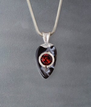 Garnet in an Onyx Geode set with Pure Silver